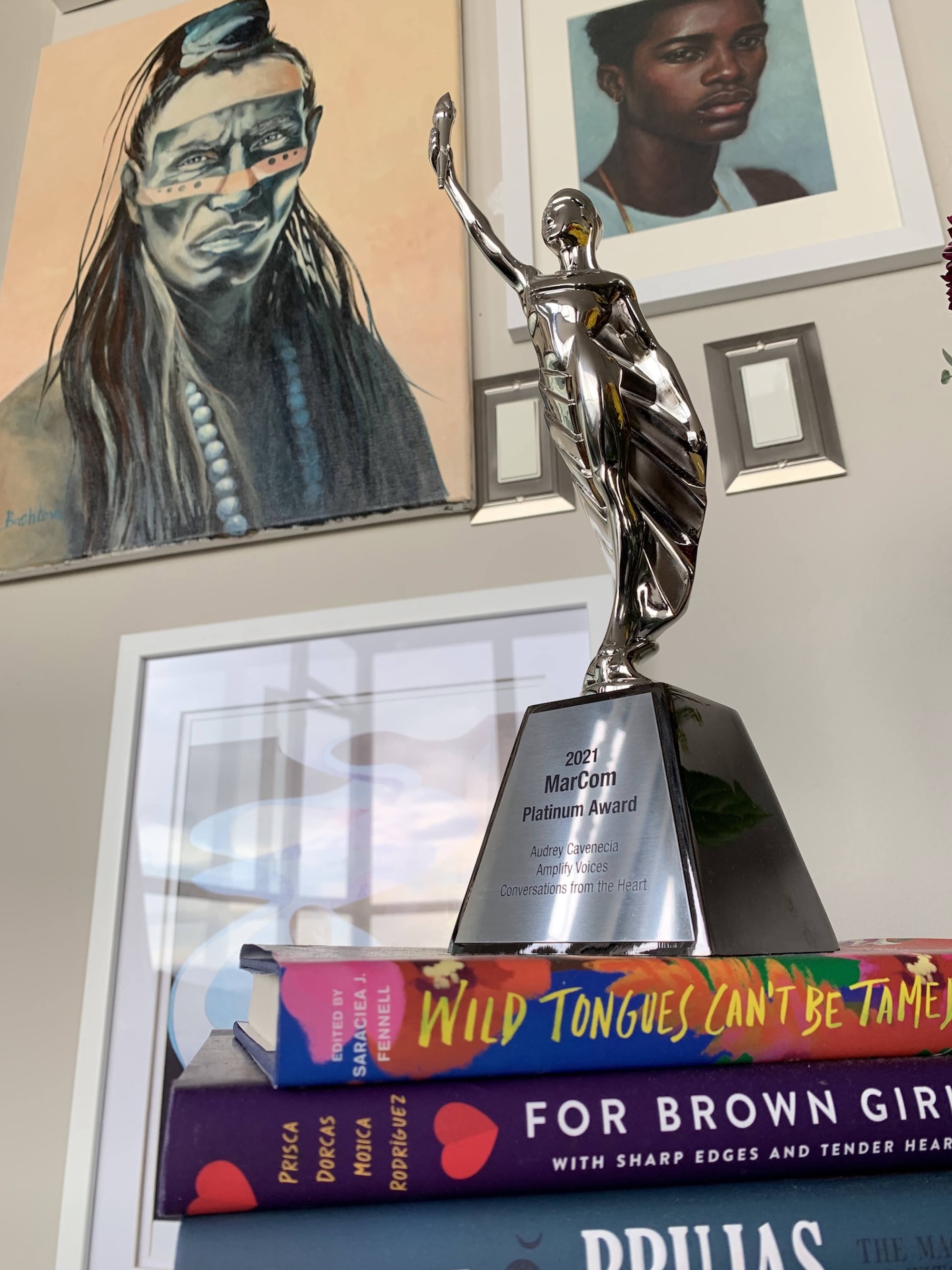 The 2021 MarCom Platinum Award on a shelf.